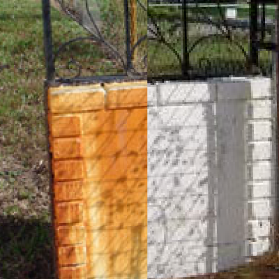 A before and after image of a white fence. Before, it is brownish-orange and rusty and gross. After, it's a pristine white.