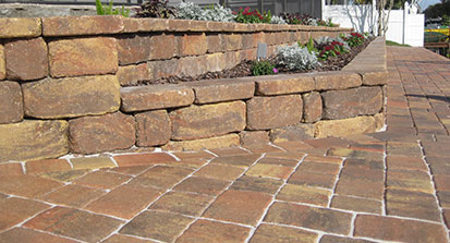 An image of stone steps freshly installed into a backyard landscape. 